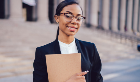 Law student wearing glasses and a black suit